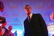 James Collins (Devon Sawa) wears a suit and frowns as onlookers watch in Chucky 304.