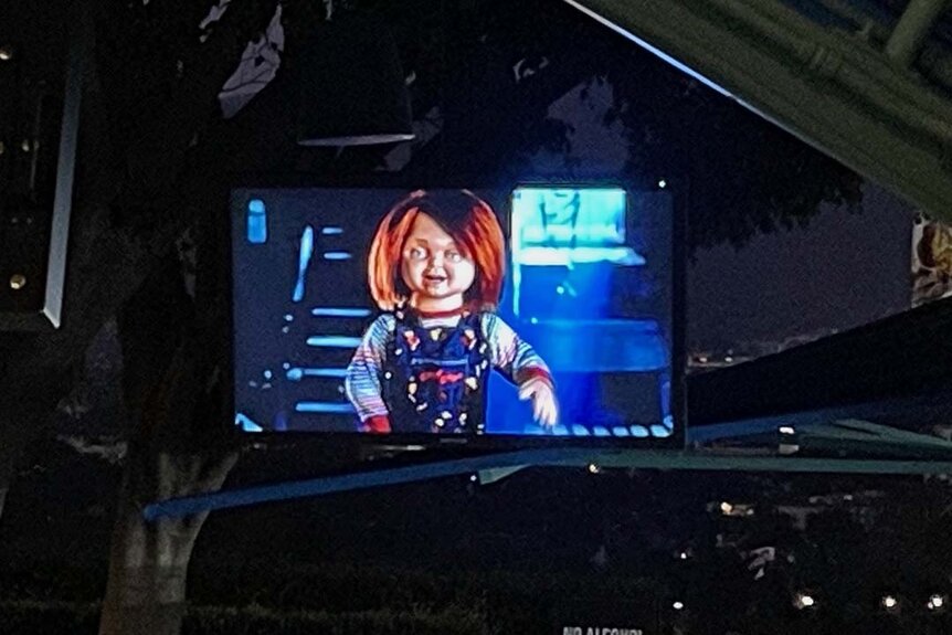 Chucky on a screen at the Chucky Terror Tram at Halloween Horror Nights 2023 at Universal Studios Hollywood.